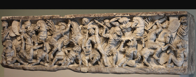 An image of a marble scene that shows a Roman War